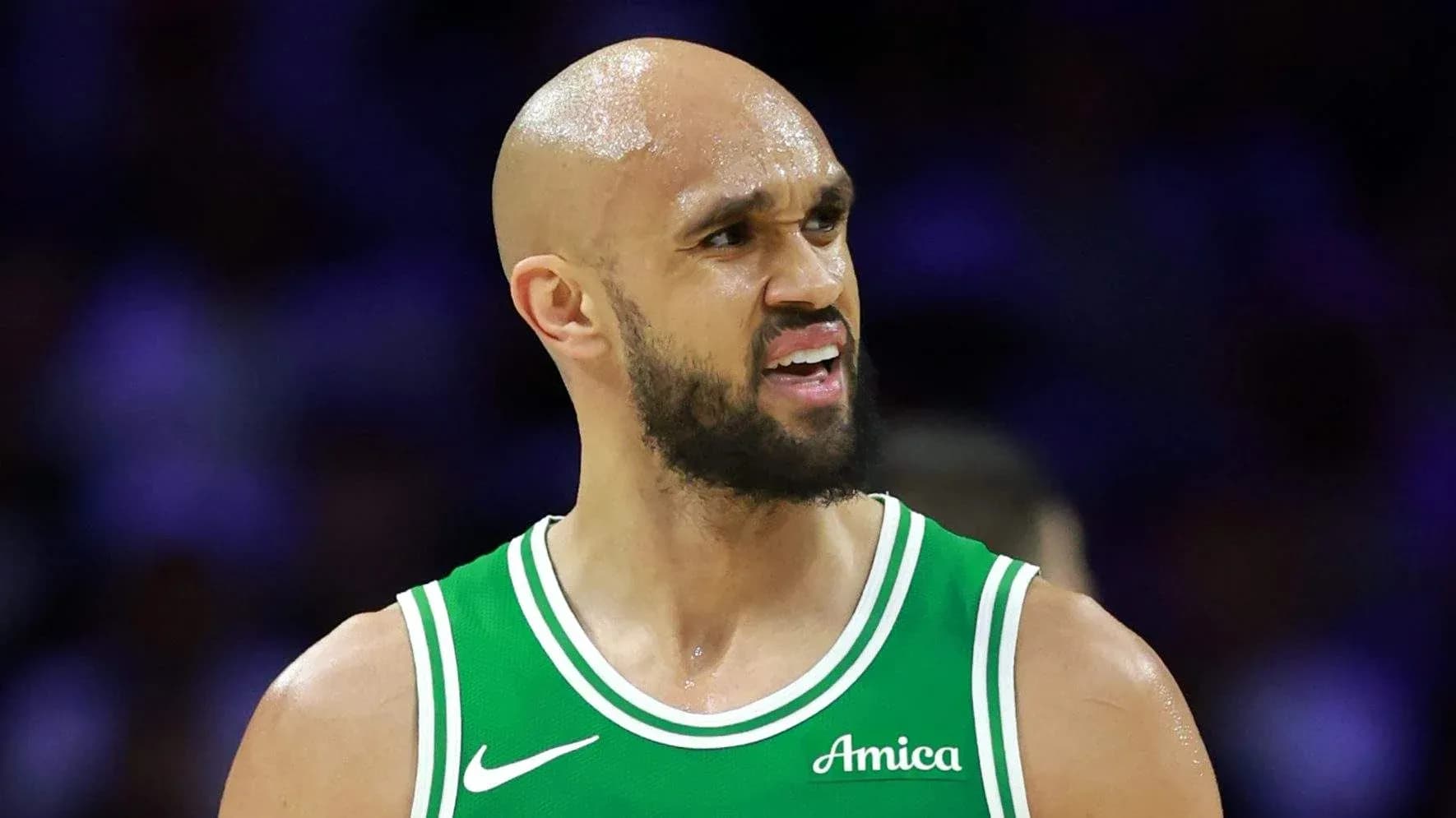 Player in green jersey during basketball game Player in green jersey during basketball game