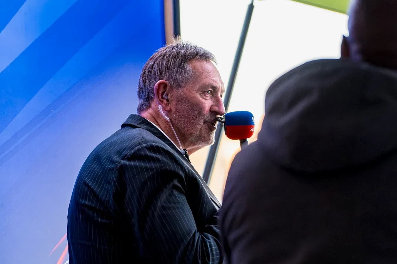 Sports commentator speaking into a microphone Sports commentator speaking into a microphone