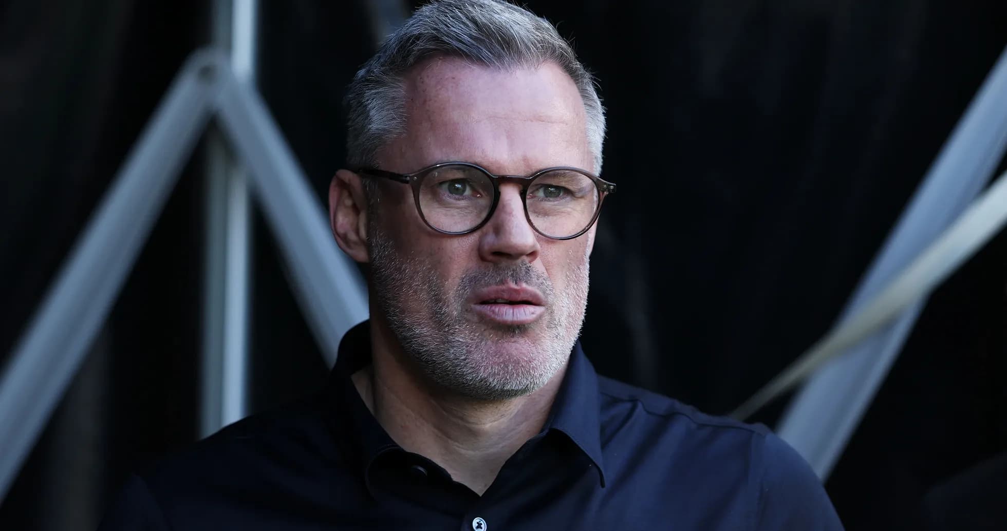 Man in glasses looking intently off-camera Man in glasses looking intently off-camera