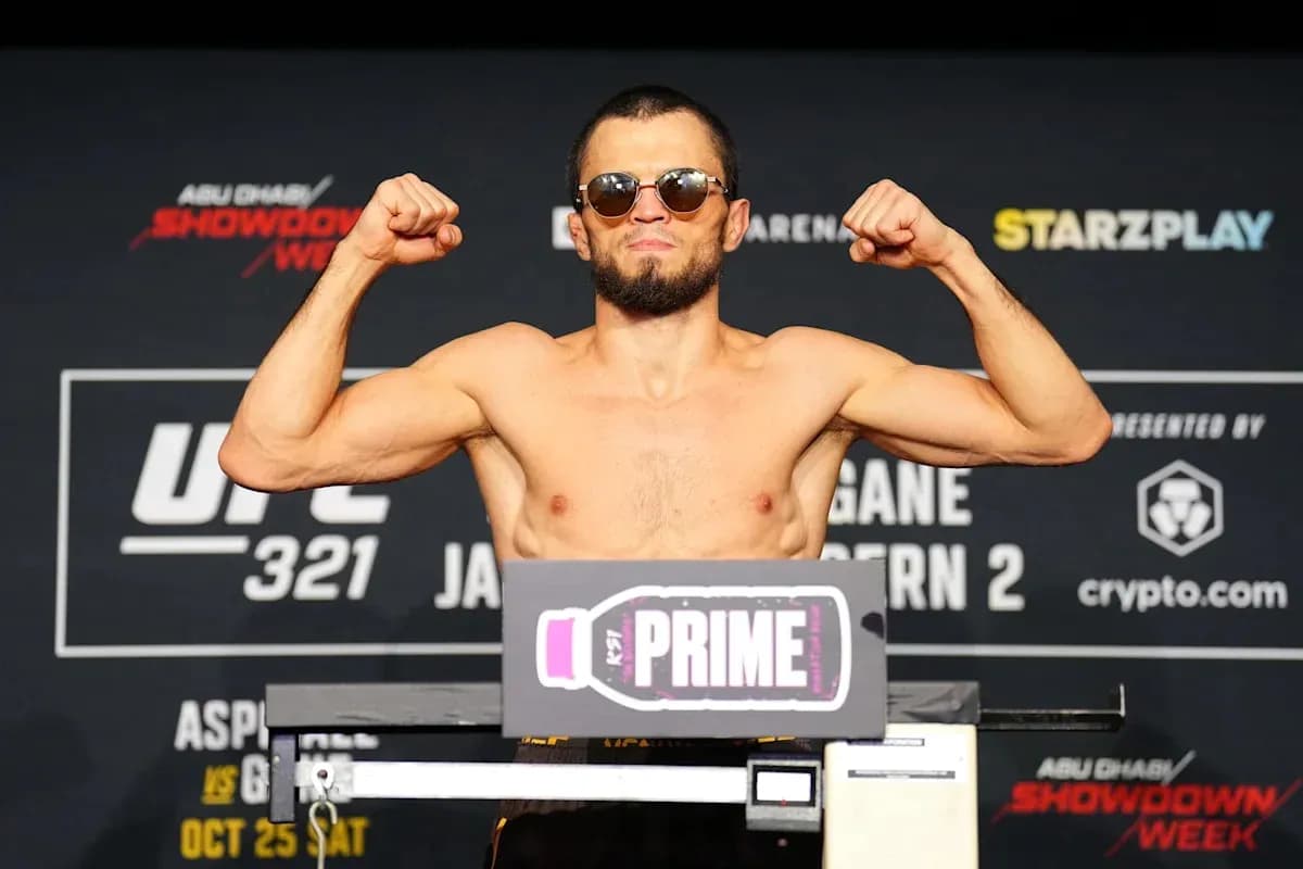 Fighter flexing muscles at weigh-in for UFC 321 Fighter flexing muscles at weigh-in for UFC 321