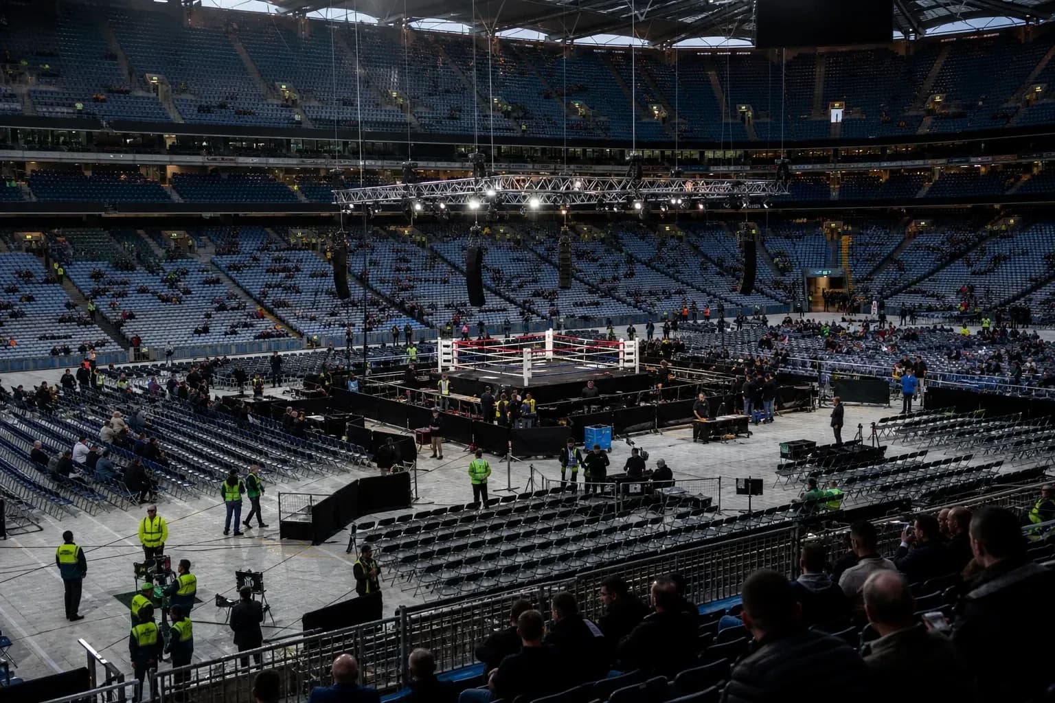 Boxing ring set up in a large empty stadium Boxing ring set up in a large empty stadium