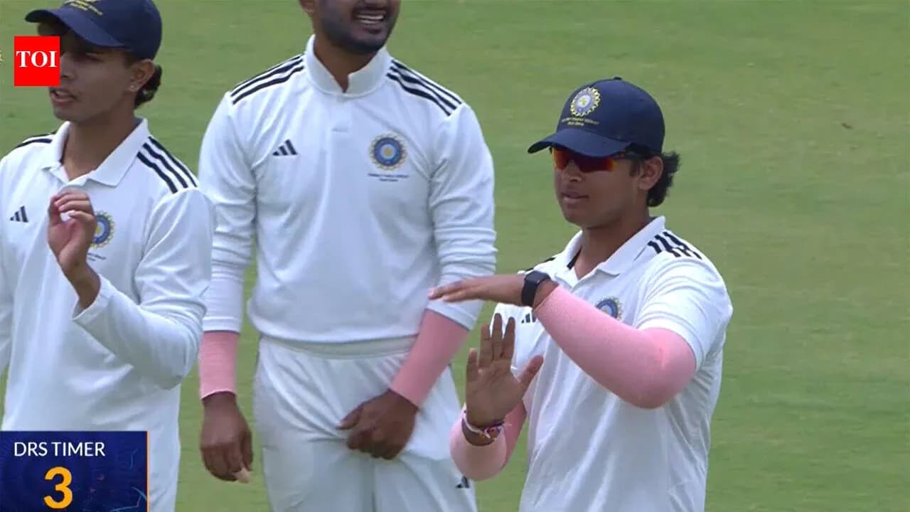 Cricketers discussing strategy on the field Cricketers discussing strategy on the field