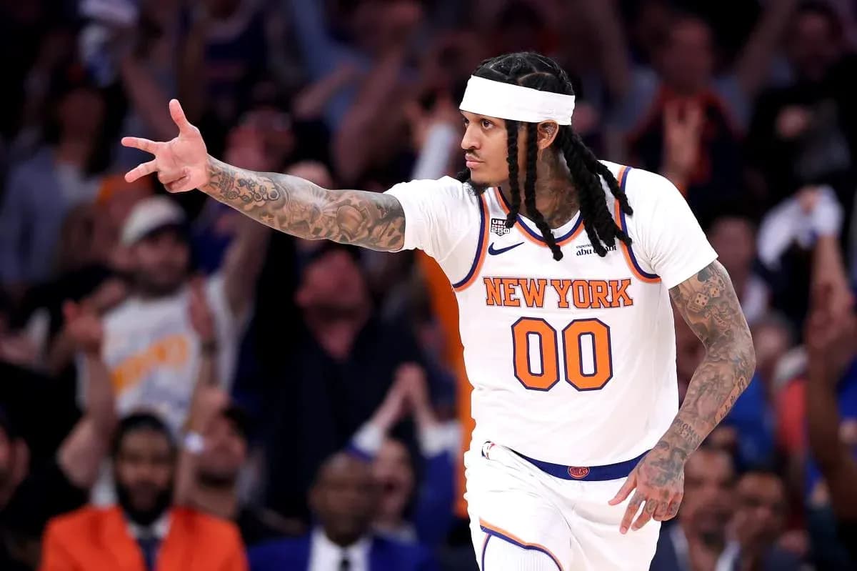Player celebrating with fans during basketball game Player celebrating with fans during basketball game