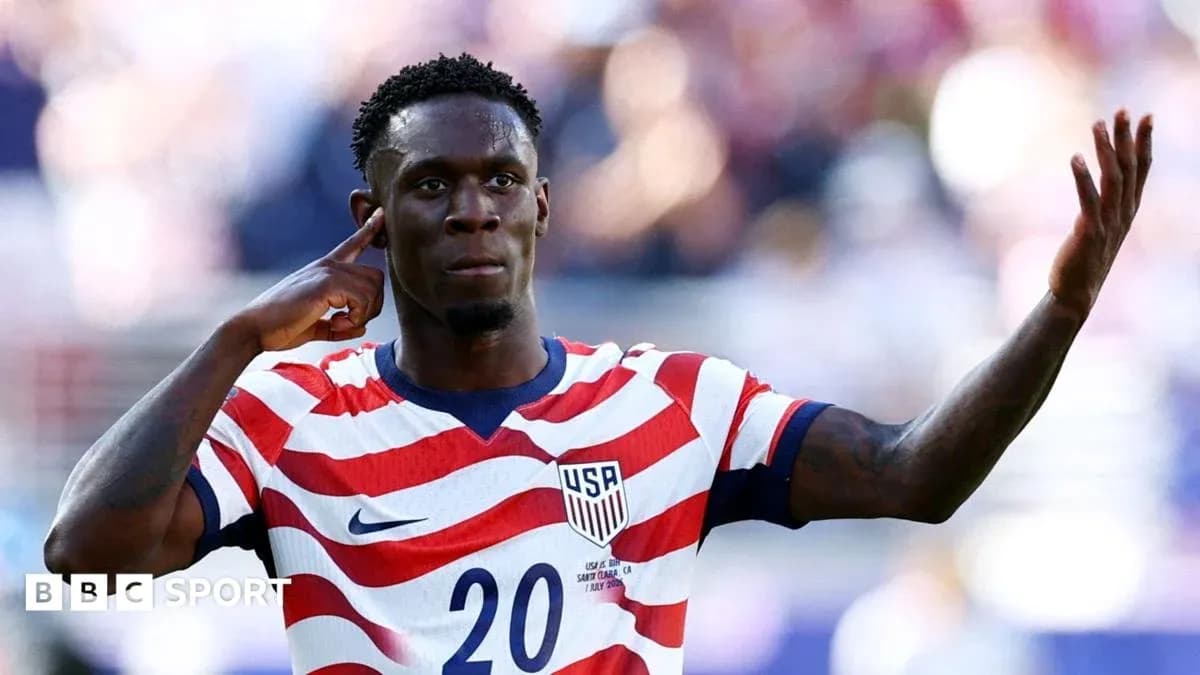 Player celebrating goal with hand gesture on field Player celebrating goal with hand gesture on field