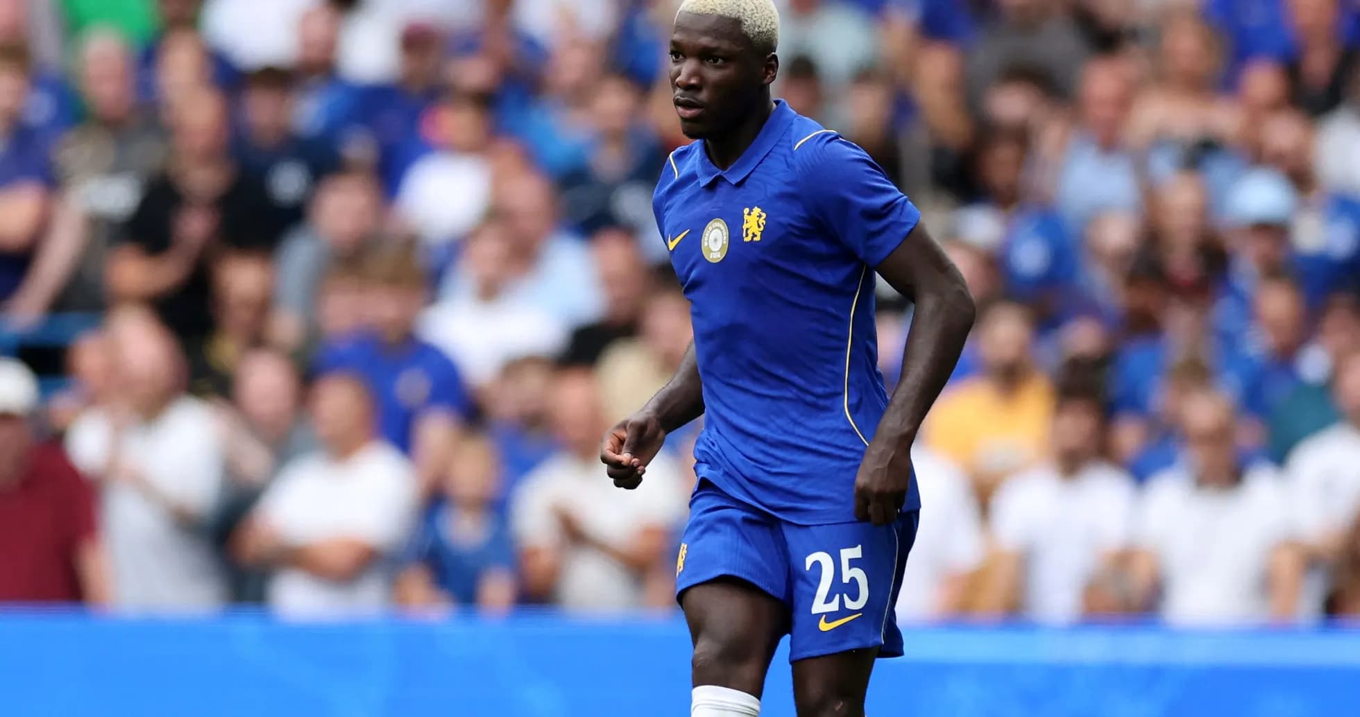 Player in blue jersey during match at stadium Player in blue jersey during match at stadium