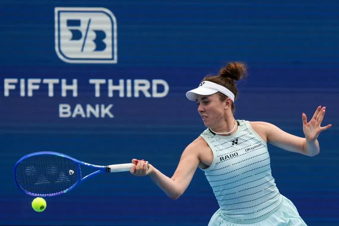 Player hitting a tennis ball during match Player hitting a tennis ball during match