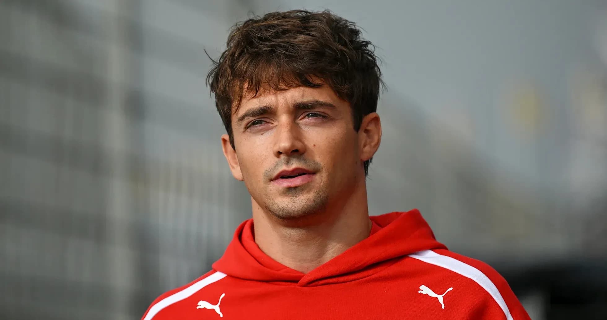 Athlete wearing red hoodie during event Athlete wearing red hoodie during event