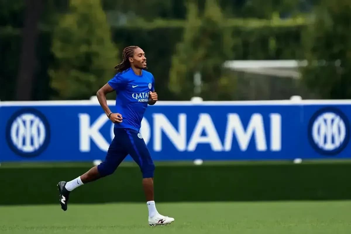 Player jogging during training session on pitch Player jogging during training session on pitch