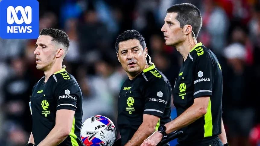 Three referees discussing during a football match Three referees discussing during a football match