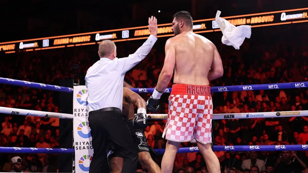 Referee stopping the boxing match in the ring Referee stopping the boxing match in the ring