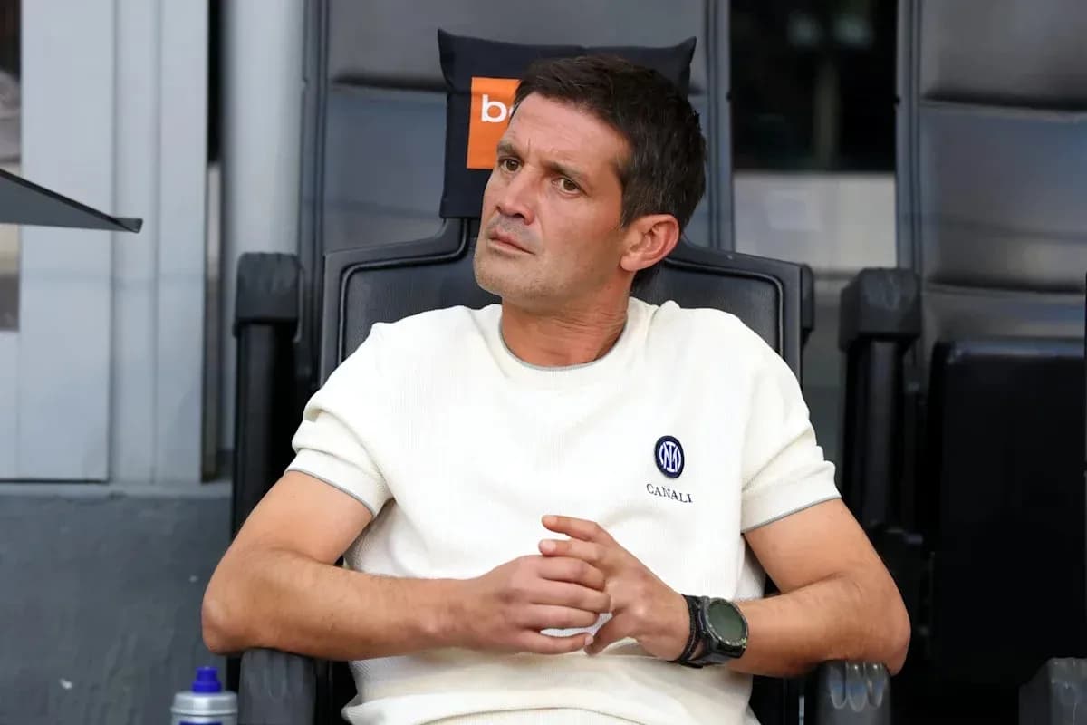 Coach sitting in the dugout during a match Coach sitting in the dugout during a match