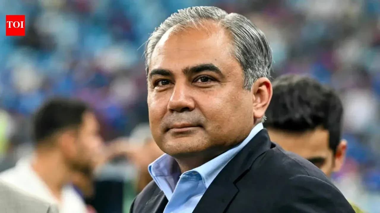 Man in suit at sporting event venue Man in suit at sporting event venue
