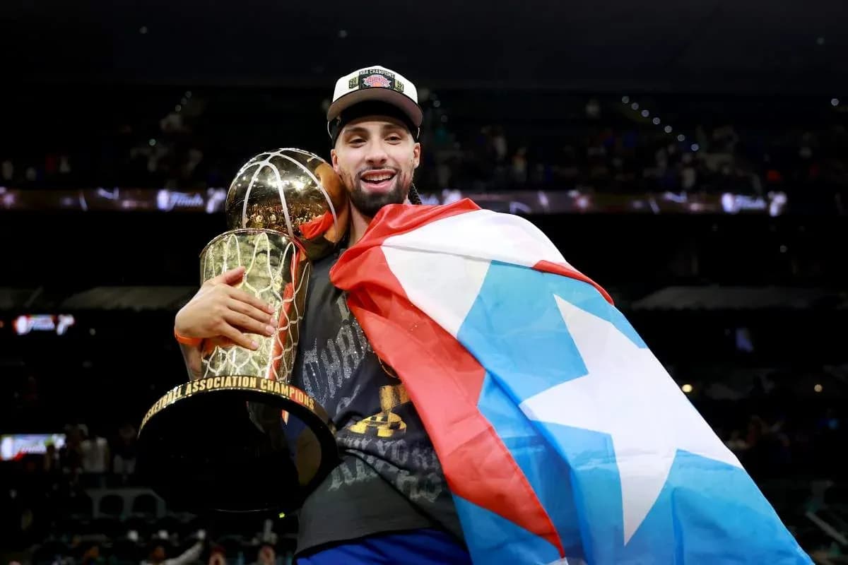 Player celebrating with trophy and flag after championship win Player celebrating with trophy and flag after championship win