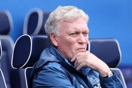 Manager seated on bench during match Manager seated on bench during match