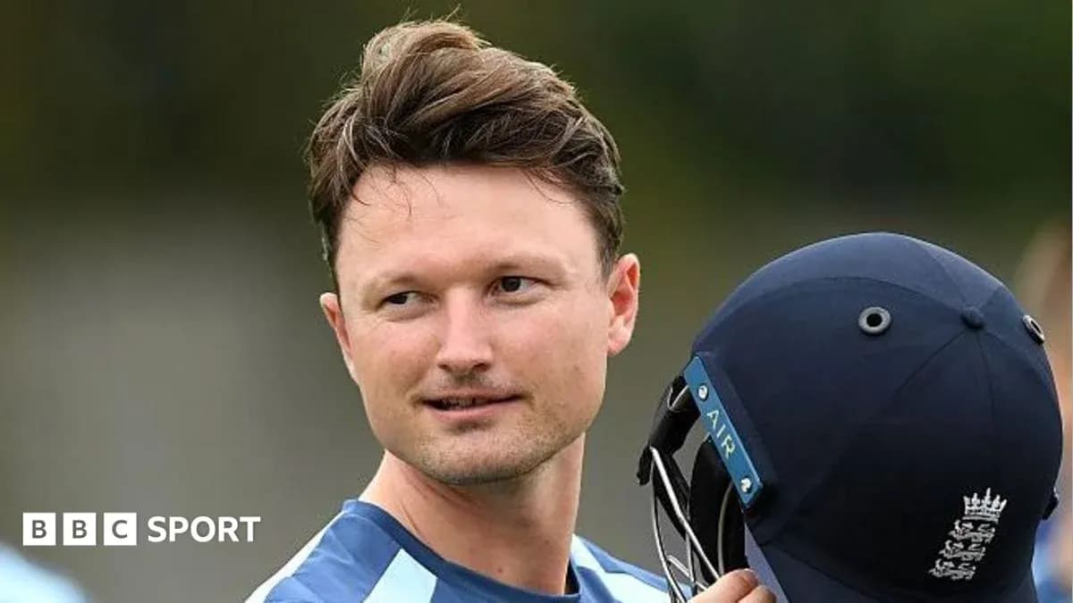 Cricketer holding helmet during practice session Cricketer holding helmet during practice session