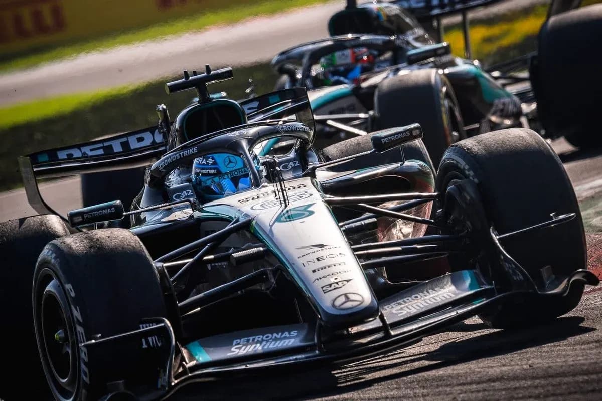 Mercedes Formula 1 car racing on track Mercedes Formula 1 car racing on track
