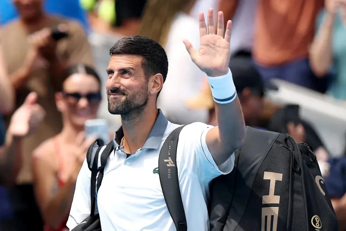 Tennis player waving to crowd after match Tennis player waving to crowd after match