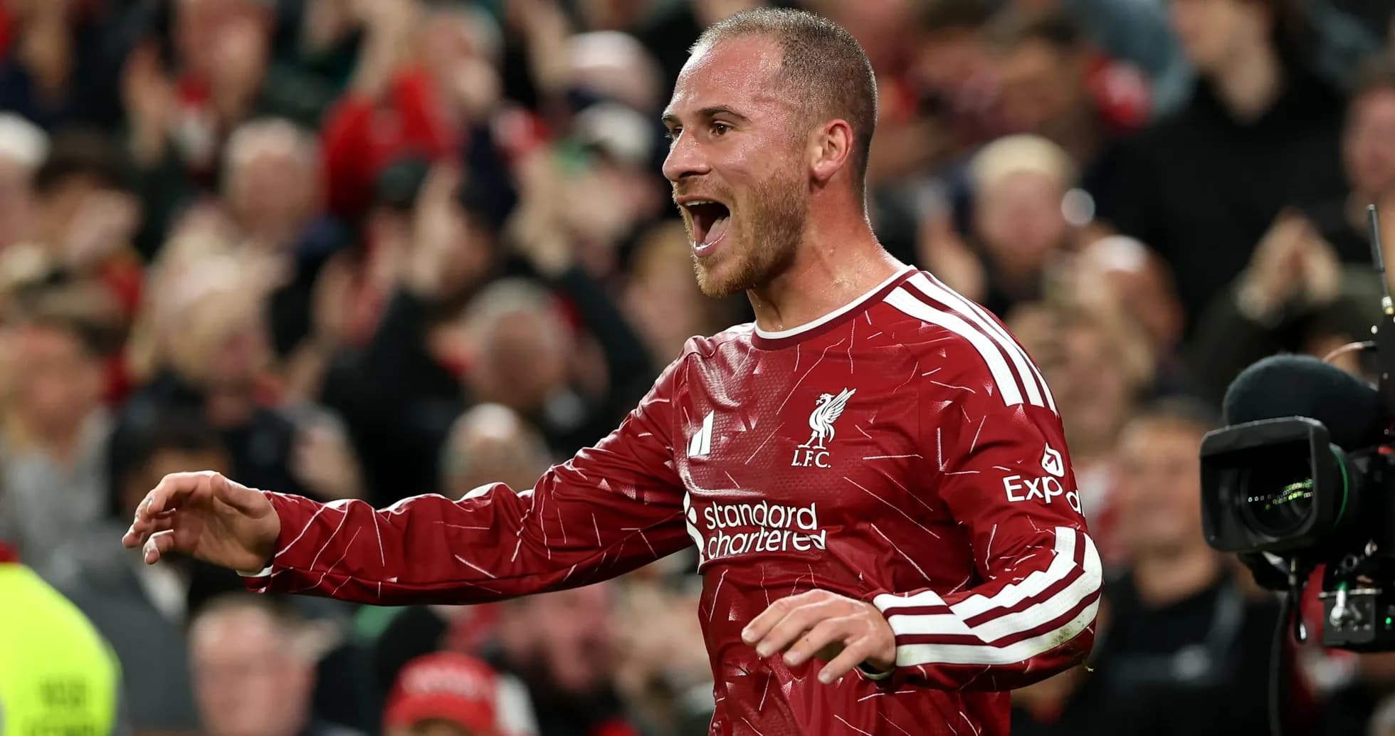 Player celebrating after scoring a goal for Liverpool Player celebrating after scoring a goal for Liverpool