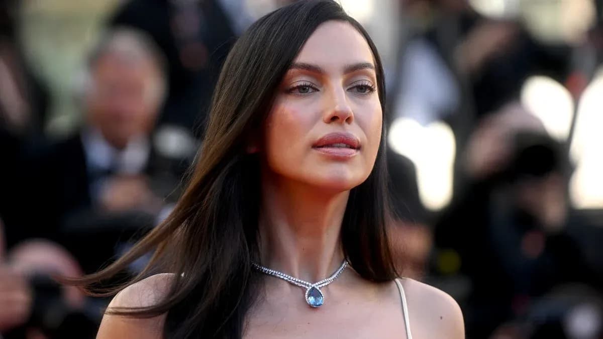 Woman with long hair wearing a necklace at event Woman with long hair wearing a necklace at event