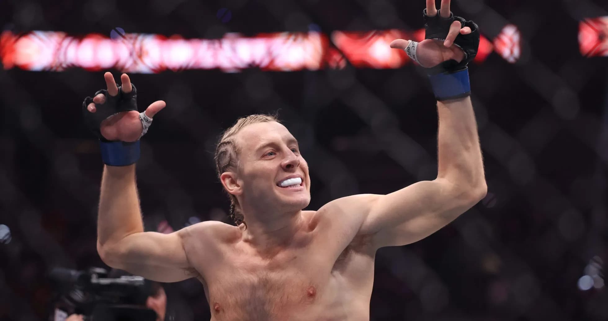 Fighter celebrating victory inside the octagon Fighter celebrating victory inside the octagon