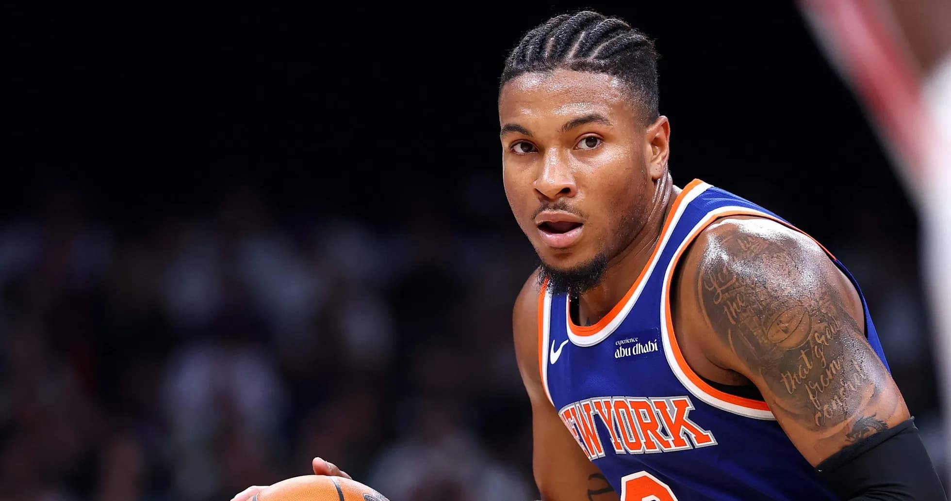Player dribbling basketball during game action Player dribbling basketball during game action