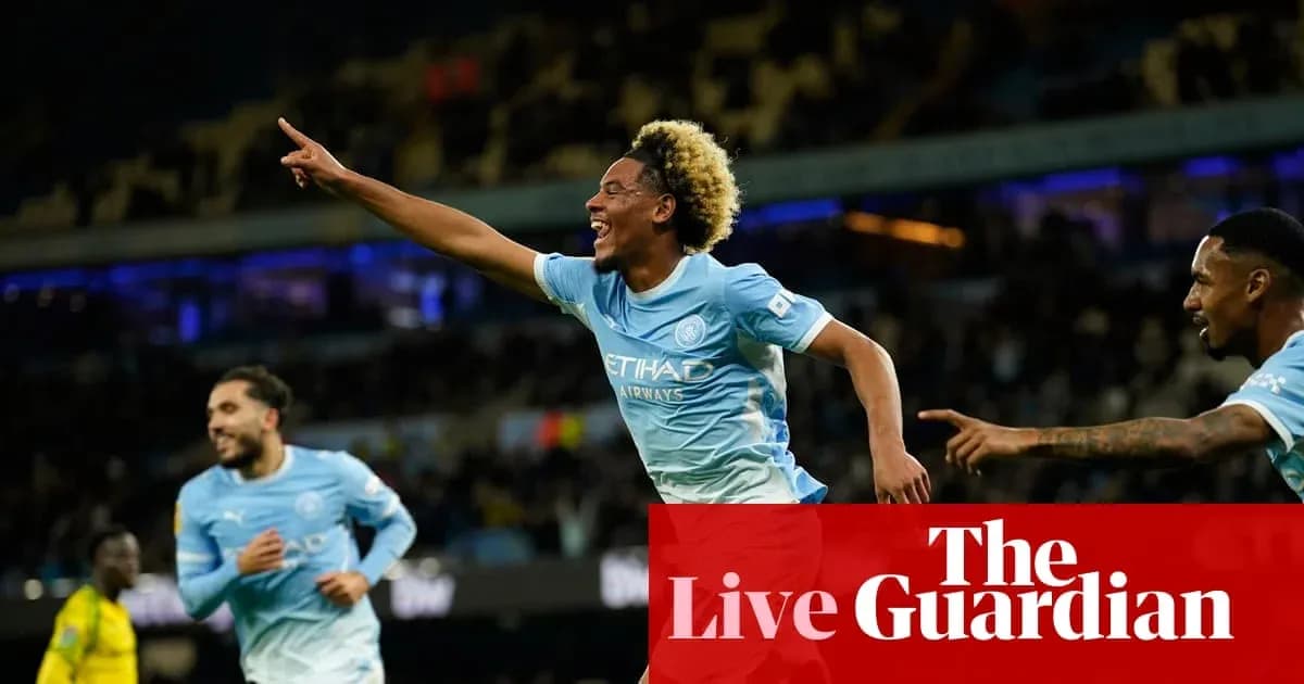 Player celebrating after scoring a goal for Manchester City Player celebrating after scoring a goal for Manchester City