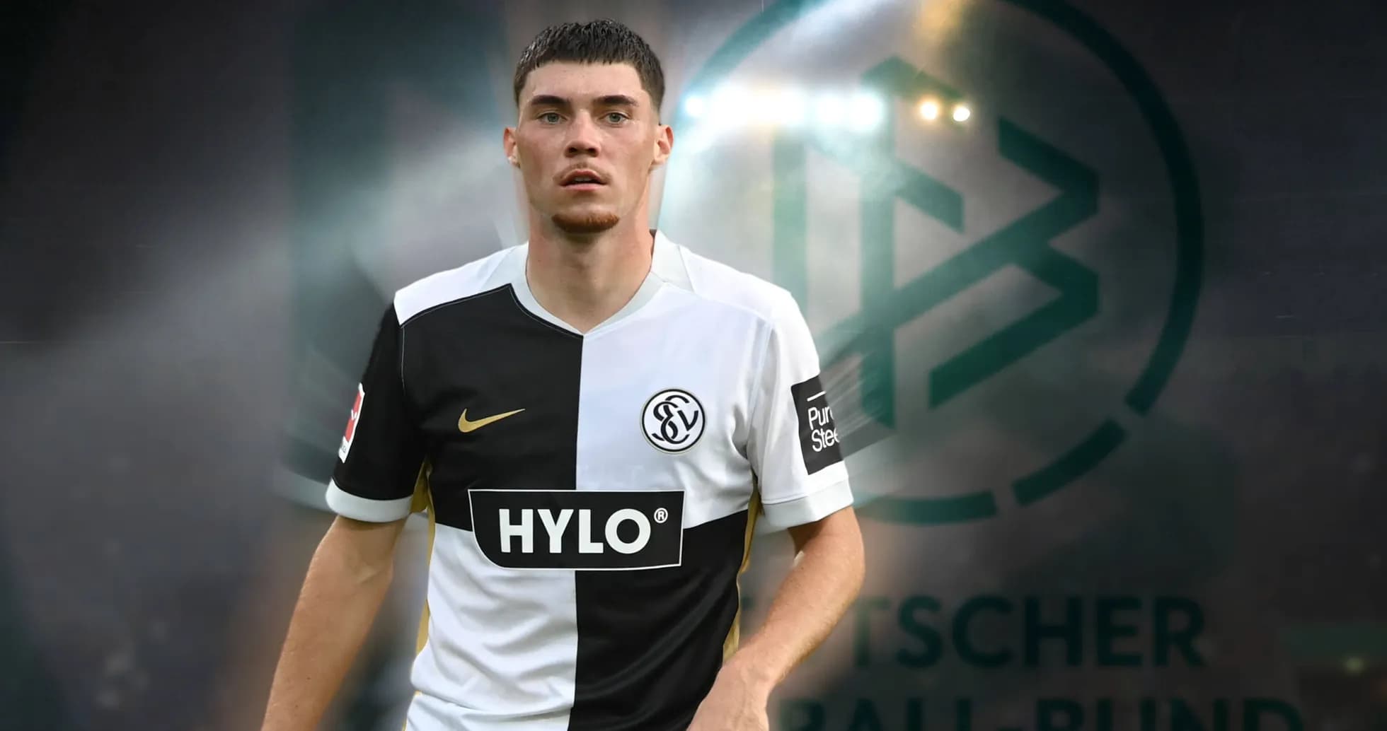 Player in team jersey with DFB logo in background Player in team jersey with DFB logo in background