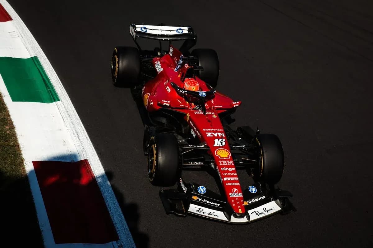 Ferrari F1 car racing on track with Italian flag Ferrari F1 car racing on track with Italian flag
