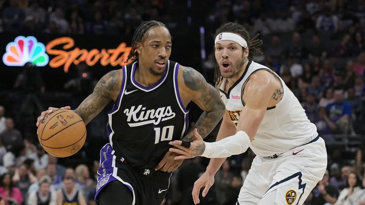 Player dribbling basketball while being defended Player dribbling basketball while being defended