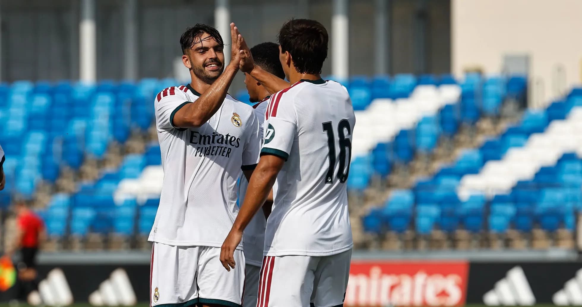 Two Real Madrid players celebrating a goal together Two Real Madrid players celebrating a goal together