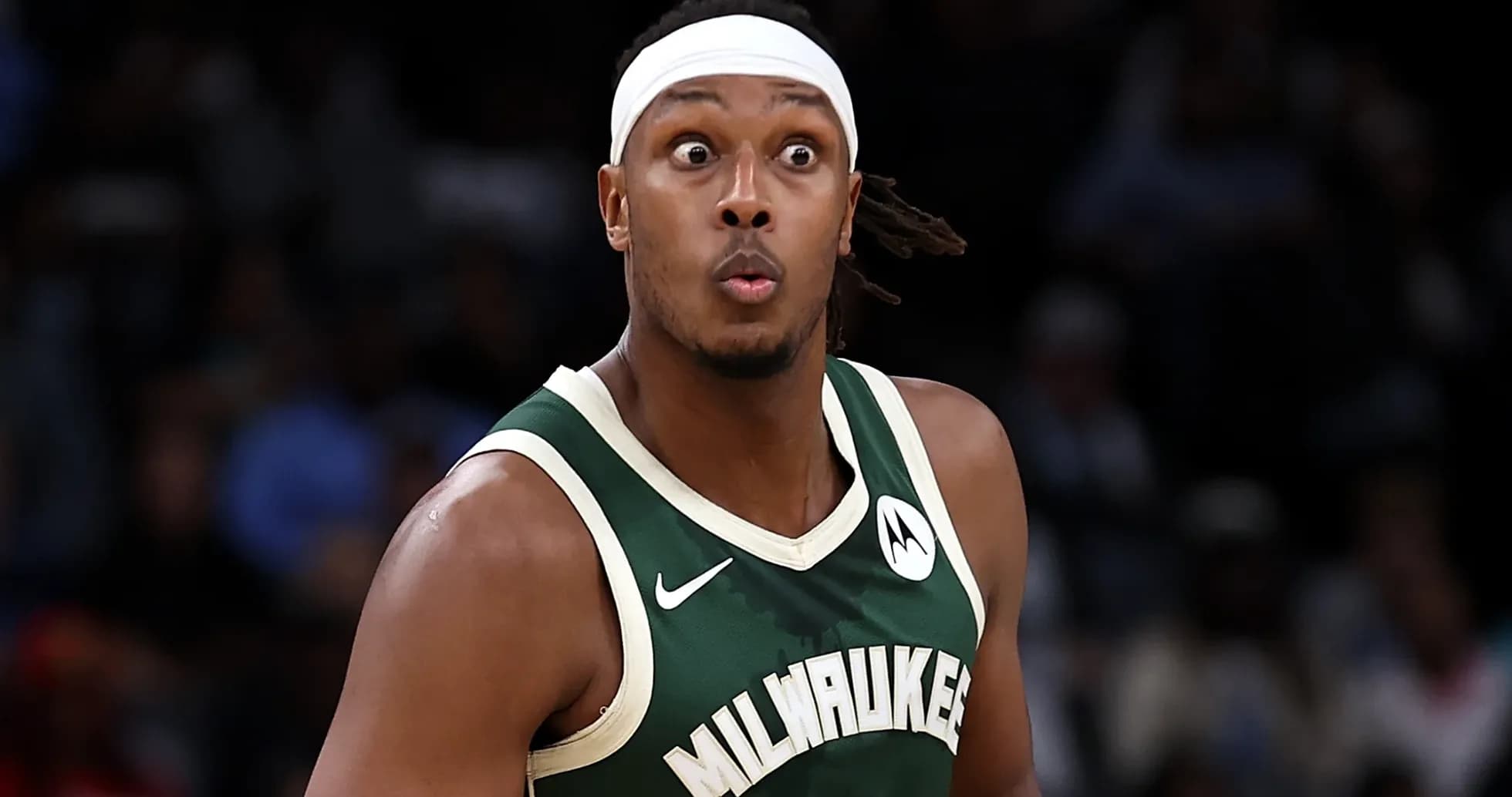 Player in Milwaukee Bucks jersey during game action Player in Milwaukee Bucks jersey during game action