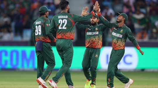 Bangladesh players celebrating a wicket on field Bangladesh players celebrating a wicket on field
