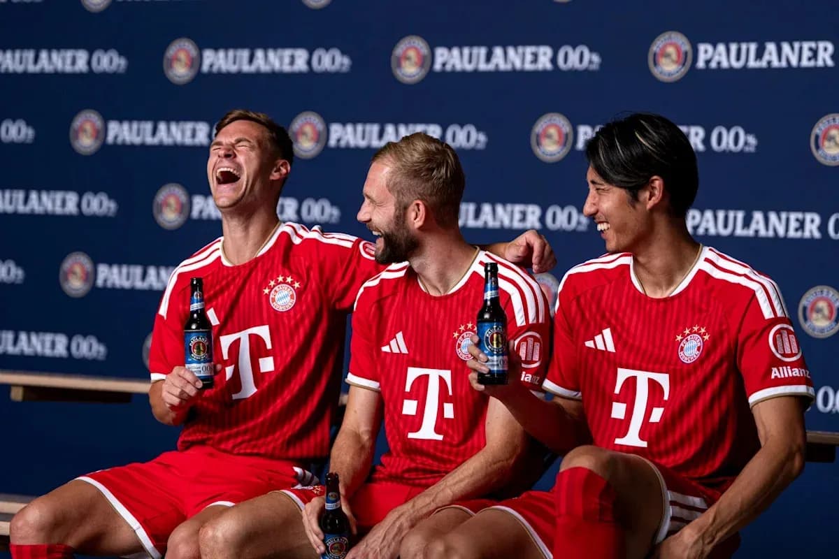 Three Bayern Munich players posing with drinks Three Bayern Munich players posing with drinks