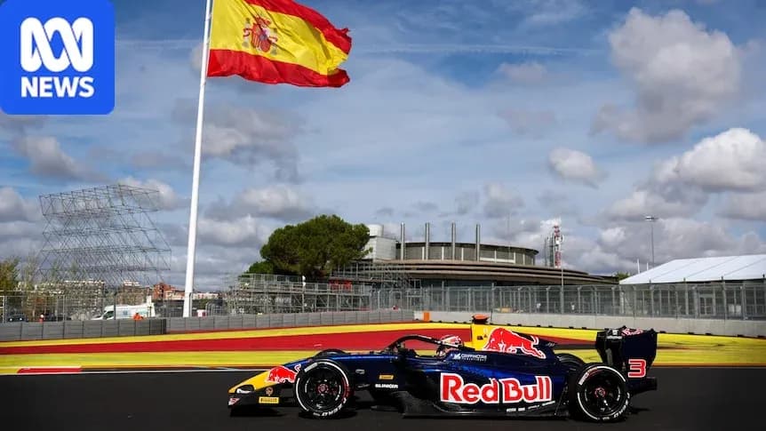 Red Bull racing car on track with Spanish flag Red Bull racing car on track with Spanish flag
