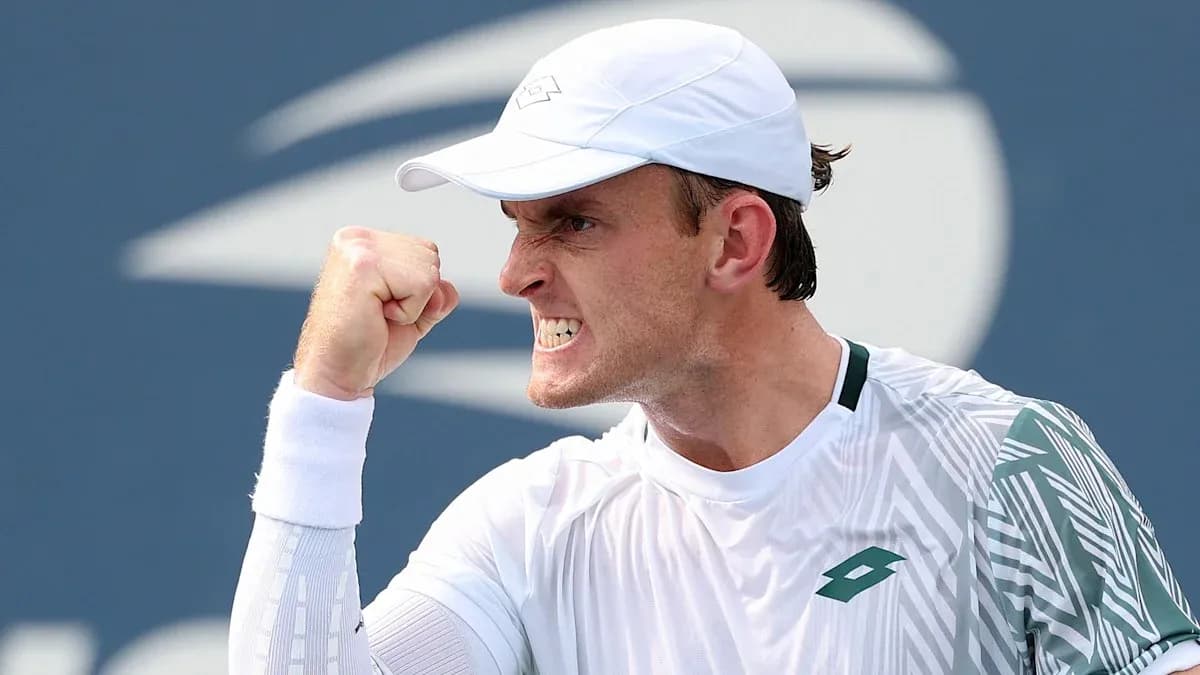 Tennis player celebrating with a clenched fist Tennis player celebrating with a clenched fist