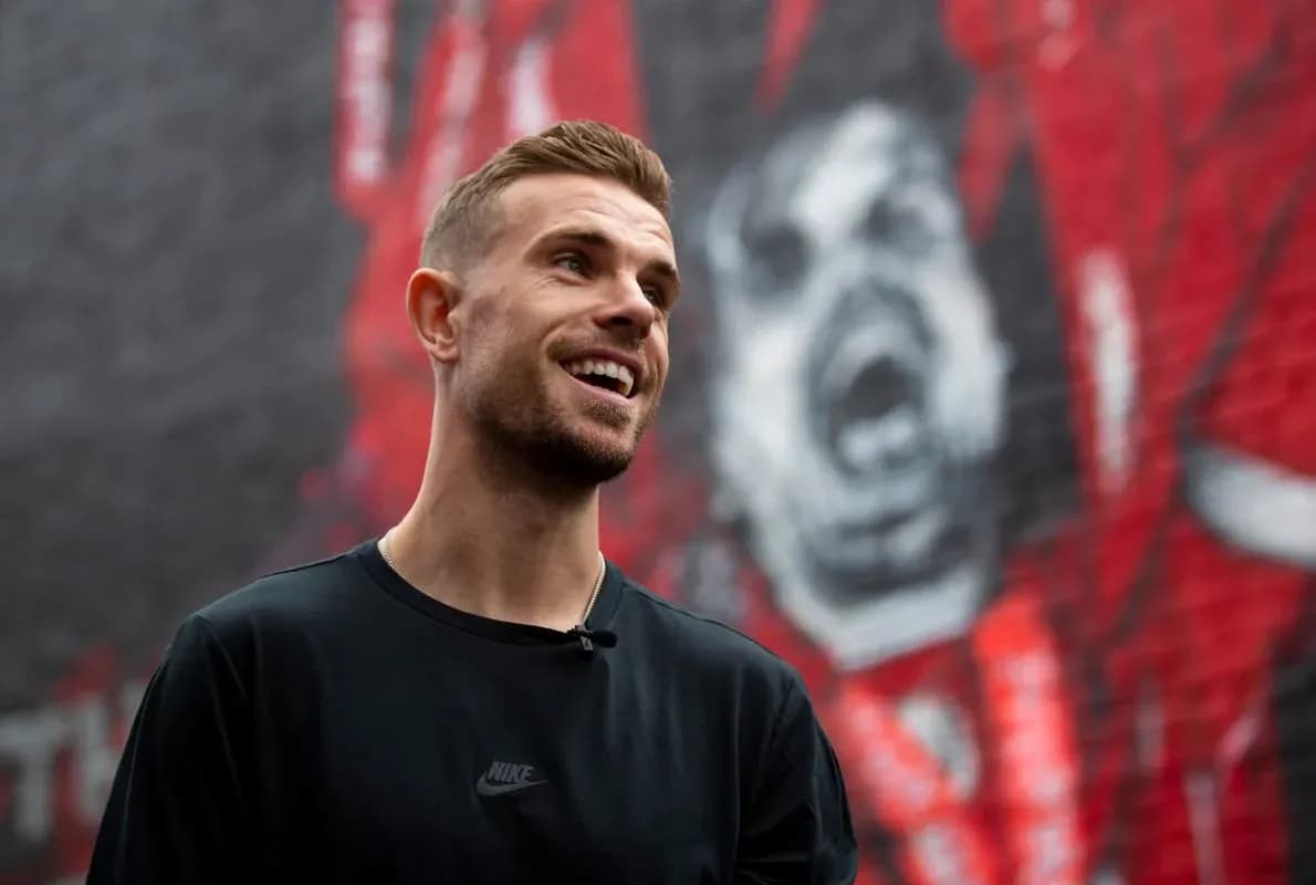 Player smiling in front of mural background Player smiling in front of mural background