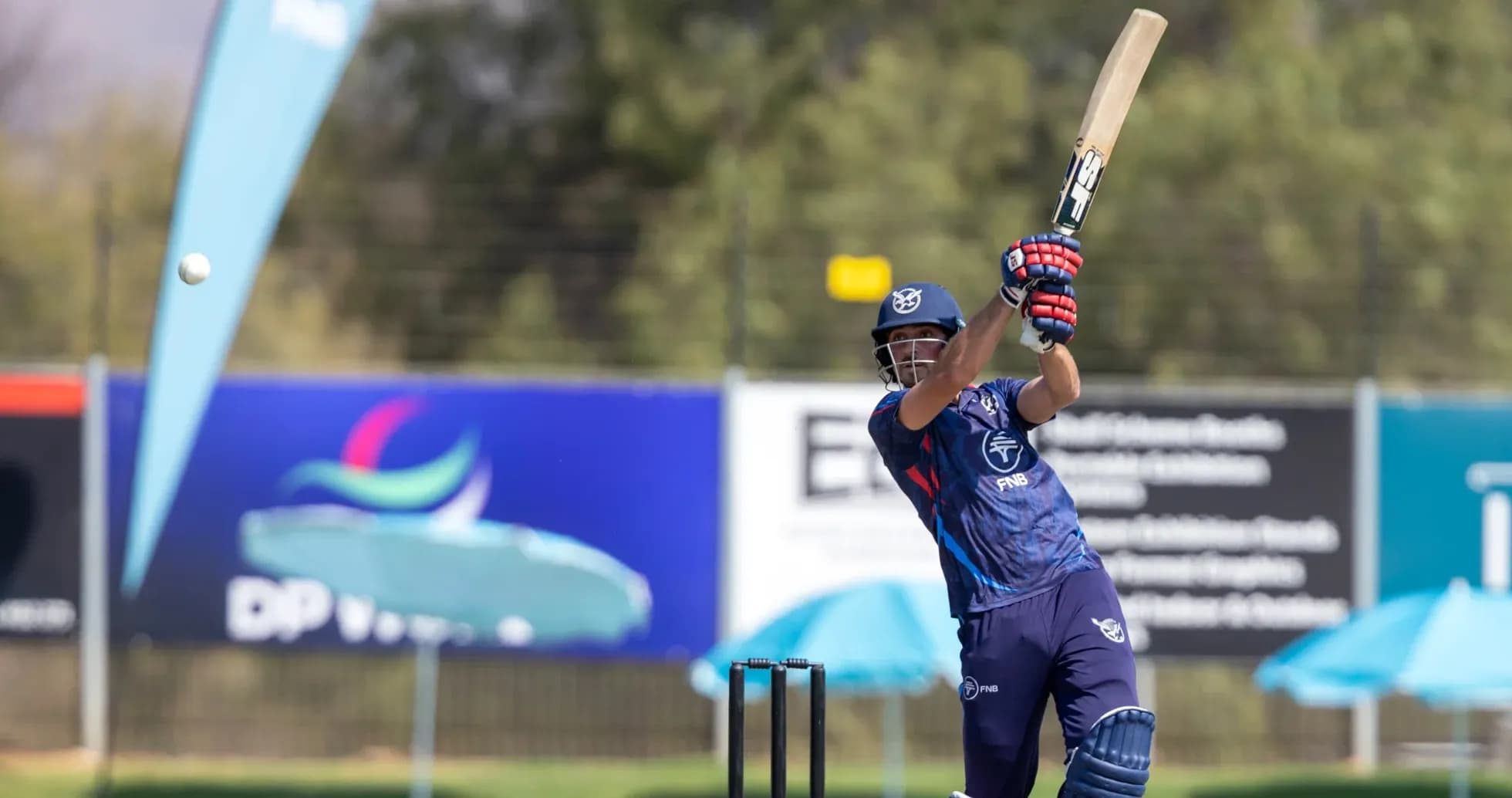 Batsman hitting a ball during cricket match Batsman hitting a ball during cricket match