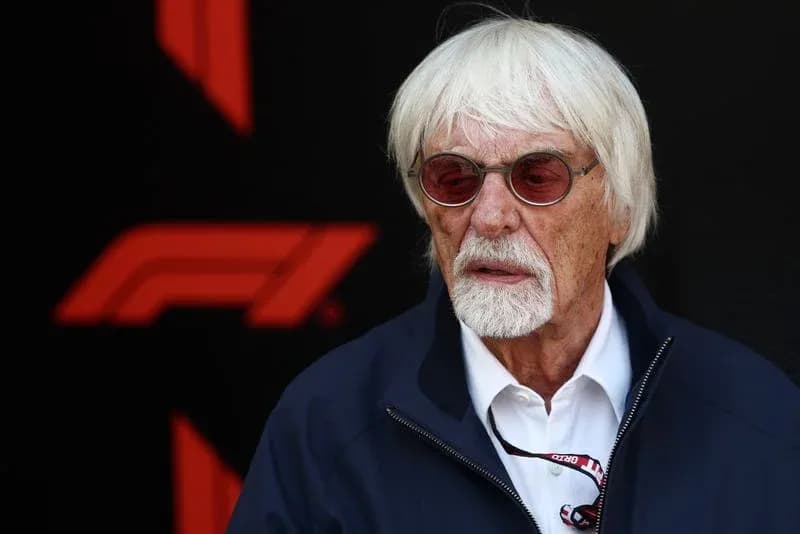 Man with white hair and glasses at F1 event Man with white hair and glasses at F1 event