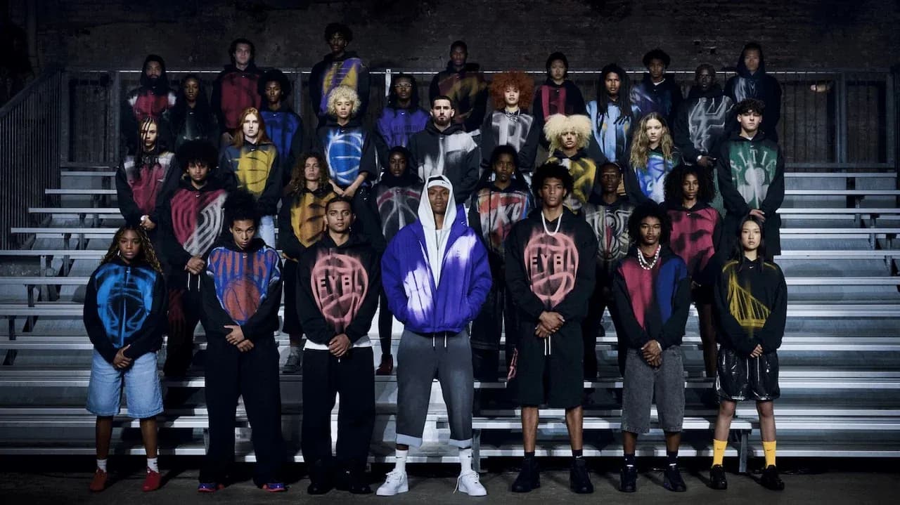 Group of young individuals posing in colorful hoodies Group of young individuals posing in colorful hoodies