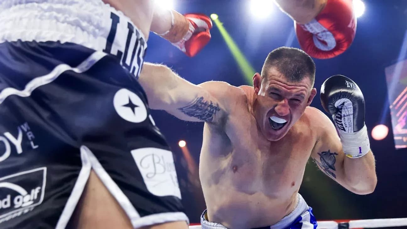 Boxer dodging a punch during a match Boxer dodging a punch during a match