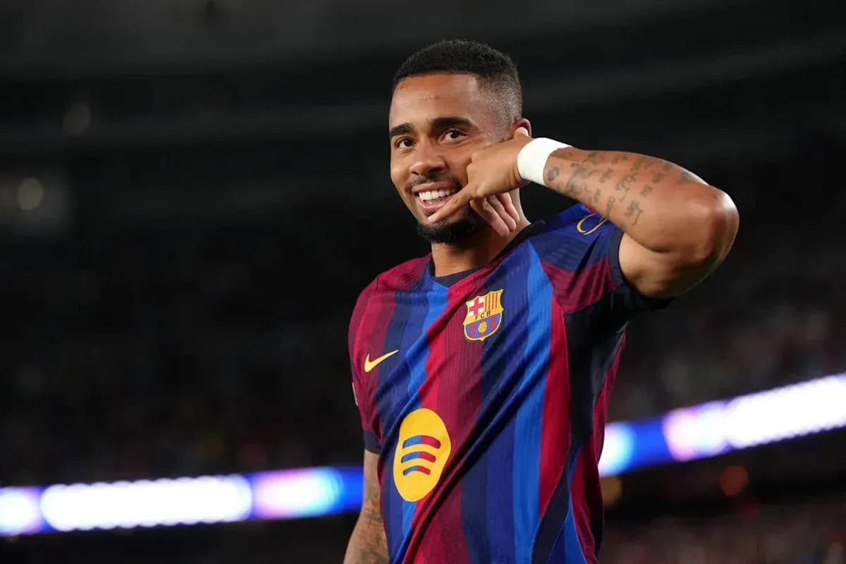 Player celebrating with a phone gesture on field Player celebrating with a phone gesture on field