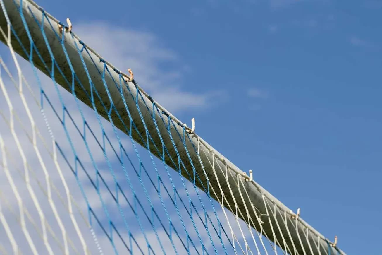 Close-up of a soccer goal net and post Close-up of a soccer goal net and post