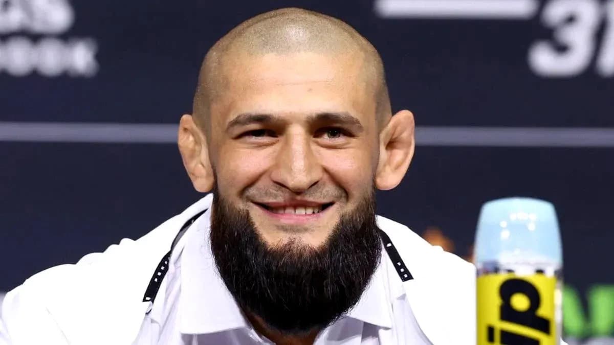 Fighter smiling at press conference table Fighter smiling at press conference table