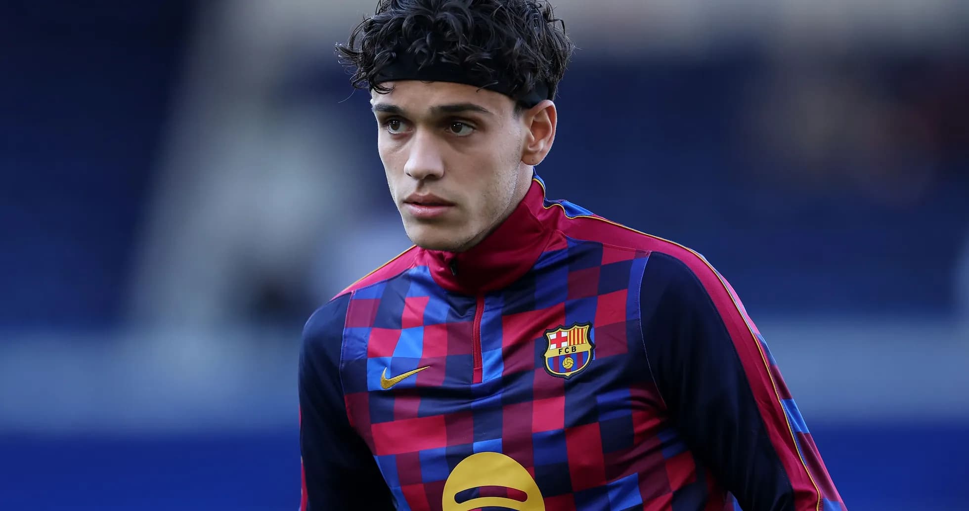 Player wearing Barcelona training kit on field Player wearing Barcelona training kit on field