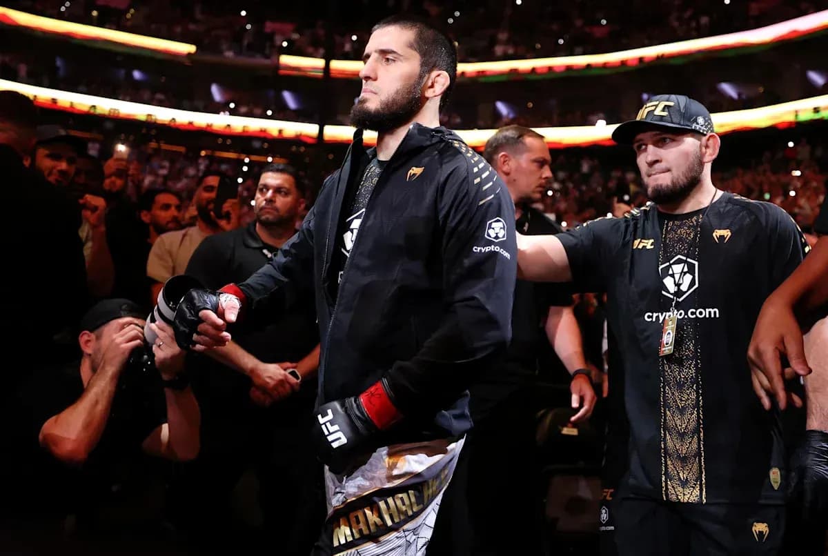 Fighter entering the arena with team members Fighter entering the arena with team members