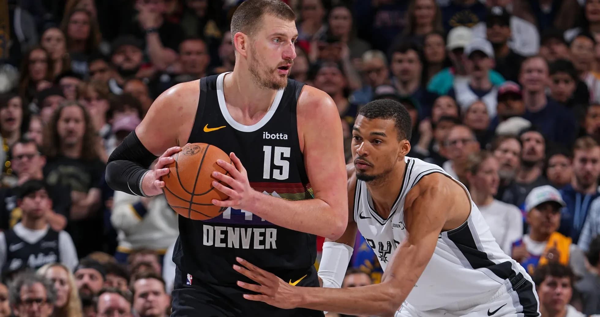 Player with ball guarded by opponent during game Player with ball guarded by opponent during game