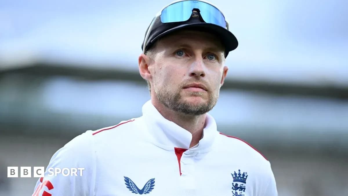 Cricketer in England kit looking serious on field Cricketer in England kit looking serious on field