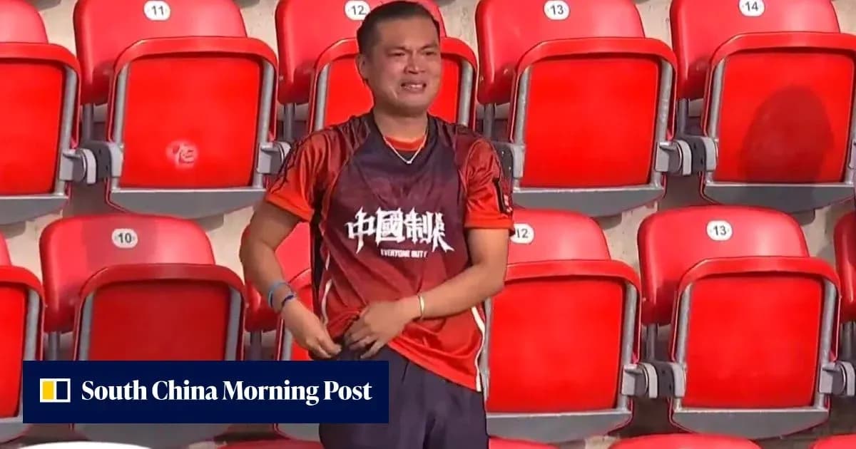 Fan wearing team jersey in empty stadium seats Fan wearing team jersey in empty stadium seats