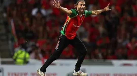 Player celebrating a wicket during cricket match Player celebrating a wicket during cricket match