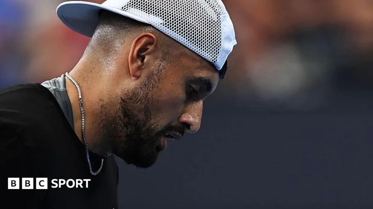 Tennis player looking down during a match Tennis player looking down during a match